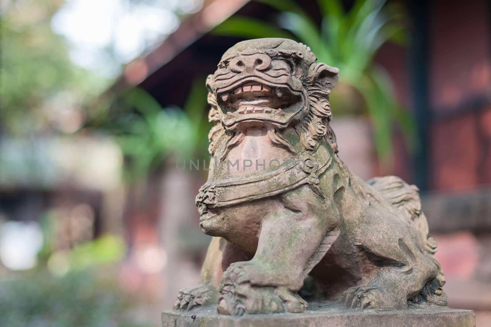 Lion stone statue in a buddhist temple, Chengdu, China