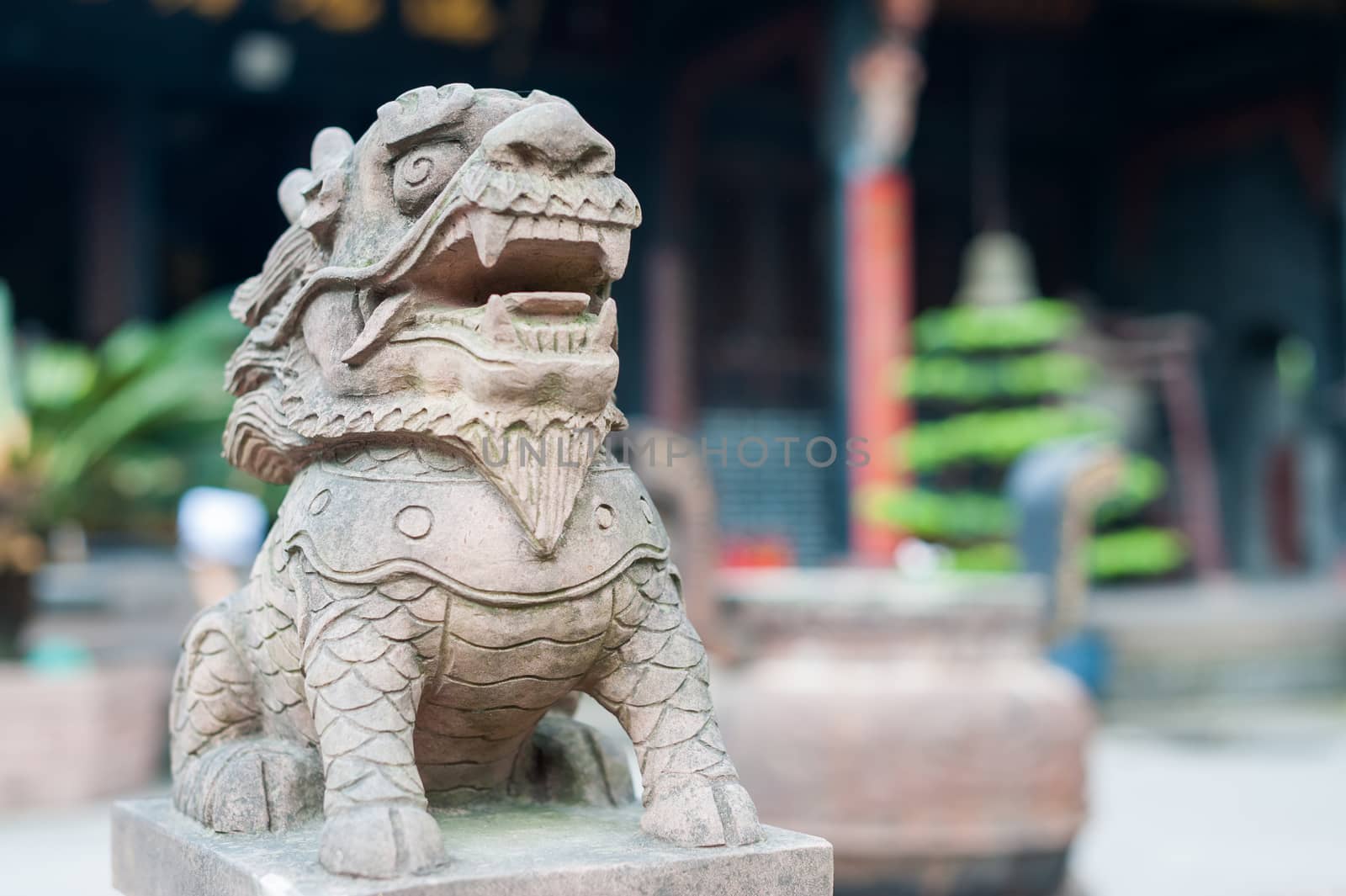 Lion stone statue in a buddhist temple, Chengdu, China