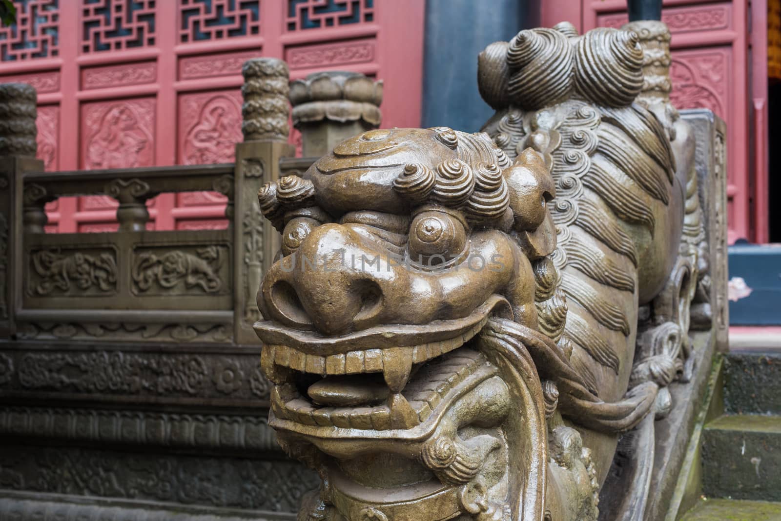 Lion stone statue on a temple stairs in Chongqing, China