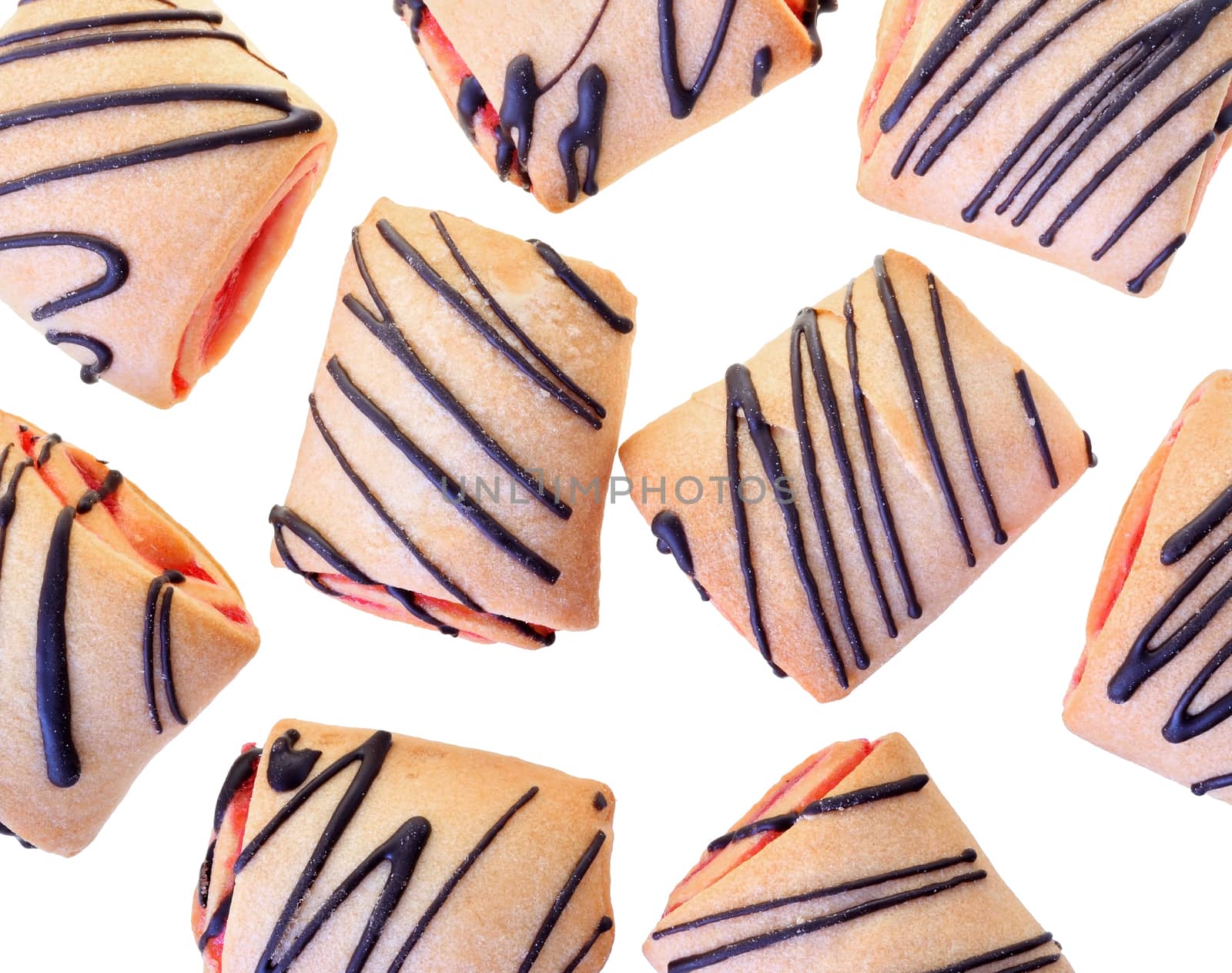 Cookies rolls with strawberry jam and chocolate icing top view isolated on a white background.