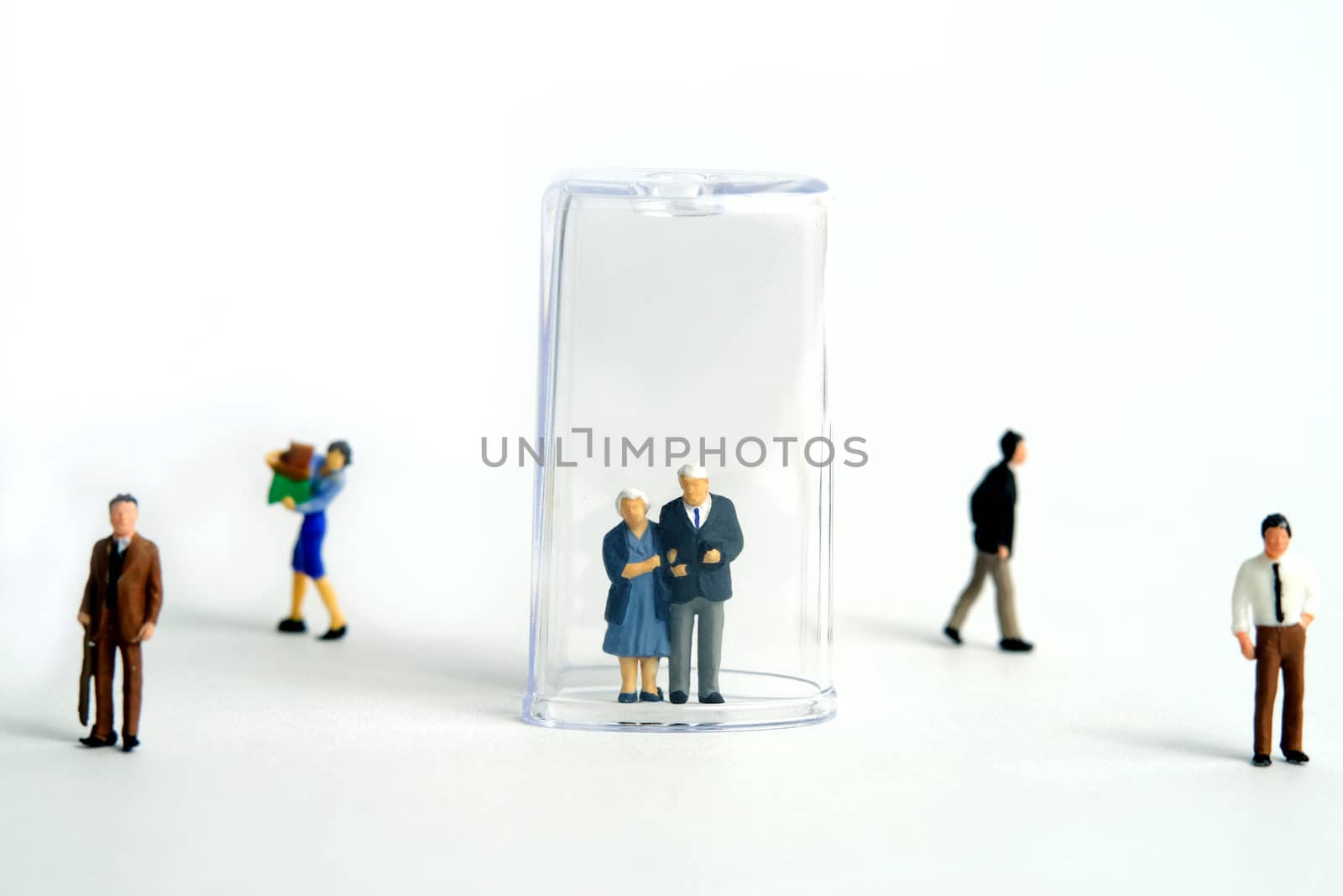 Pandemic corona virus conceptual miniature people photography – social distancing strategy - middle-aged figure on tube isolation by Macrostud