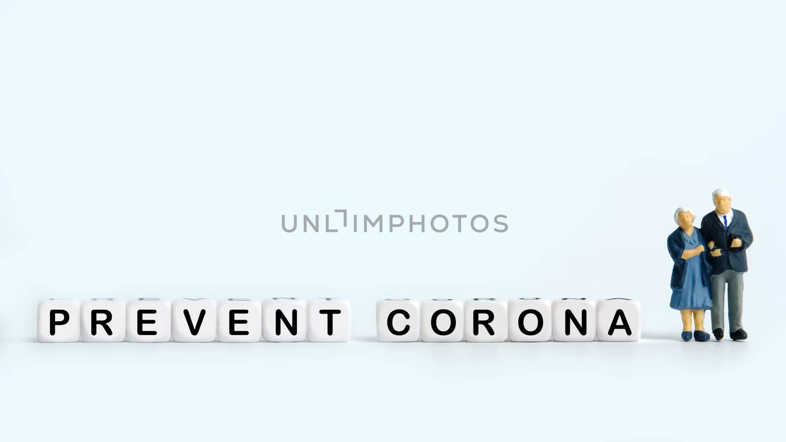 Pandemic corona virus conceptual miniature people photography – word beads alphabet covid with doctor figure. Image Photo