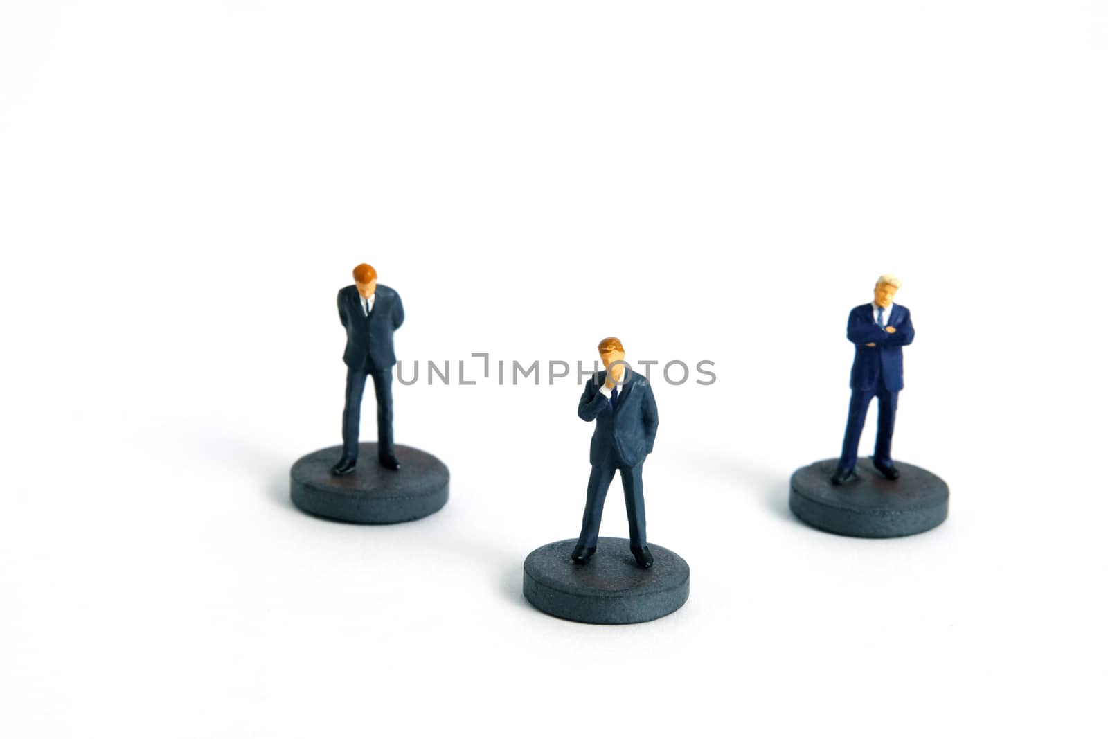 Pandemic coronavirus conceptual social distancing miniature people photography– a businessman stands on circle – a strategy to suppress the spread of viruses. Image Photo