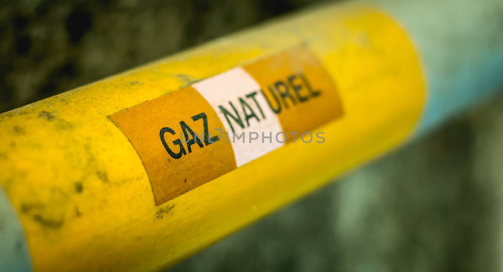 yellow gas pipe on which is written in French - natural gas by AtlanticEUROSTOXX