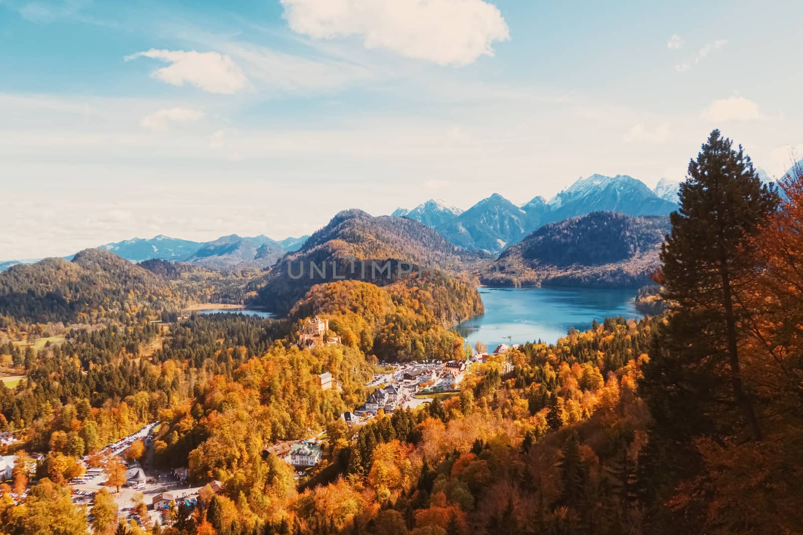 Beautiful nature of European Alps, landscape view of alpine mountains, lake and village in autumn season, travel and destination scenery