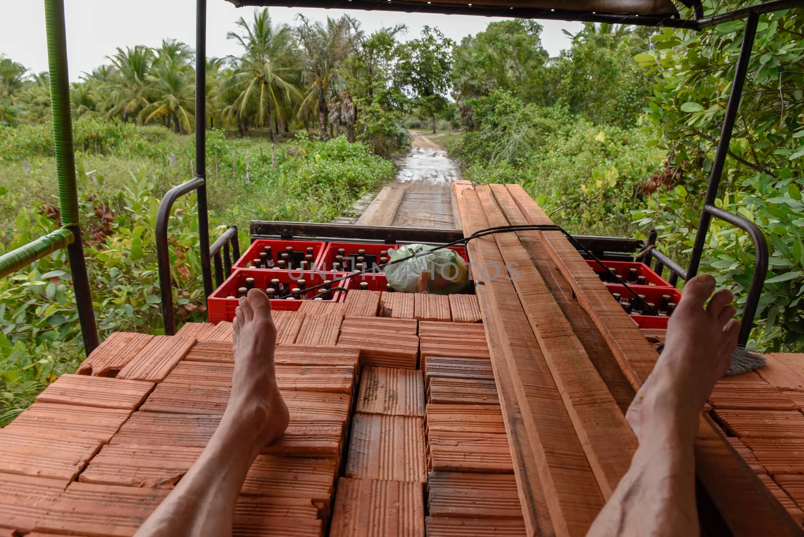 Man traveling sitting on the load of a truck at Barreirinhas on by Fotoember