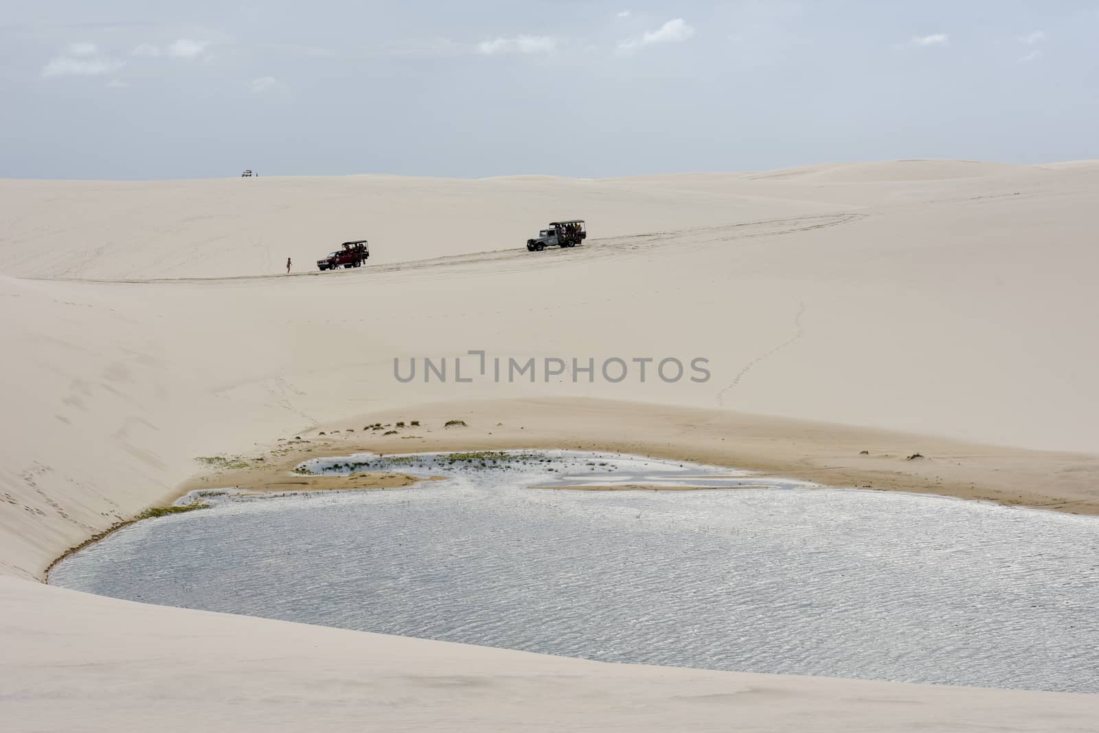 Atins, Brazil - 12 January 2019: tourist trucks on the dunes at Lencois Maranhenese National Park in Brazil