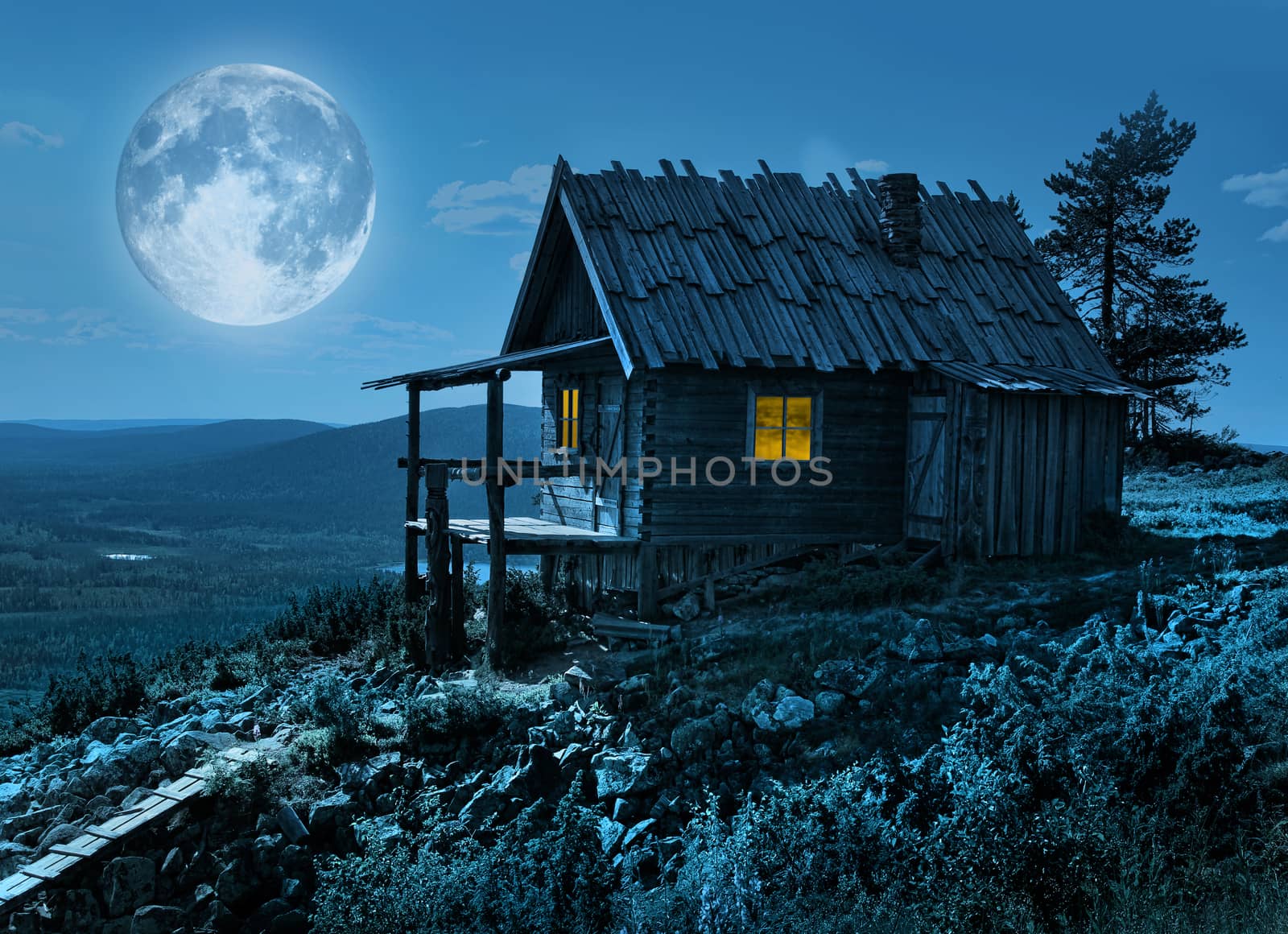 Santa Claus secret cottage on Lapland fell top in mysterious moonlight