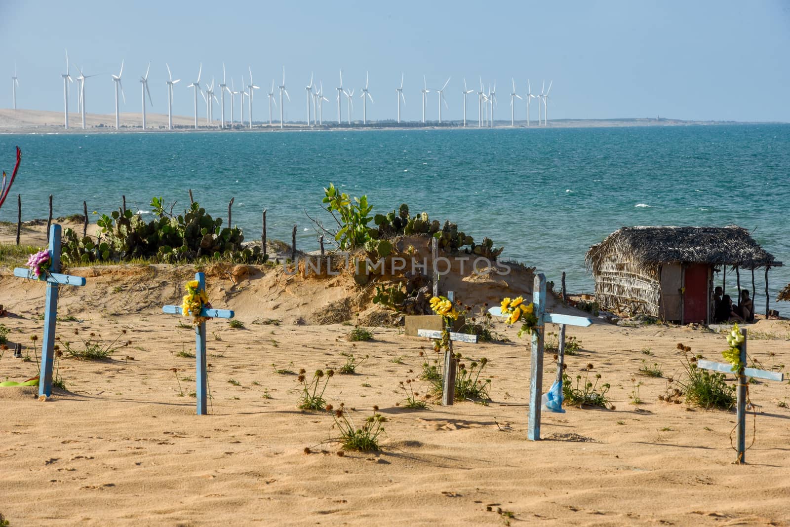 Cemetery on the beach and wind farm of Canoa Quebrada in Brazil