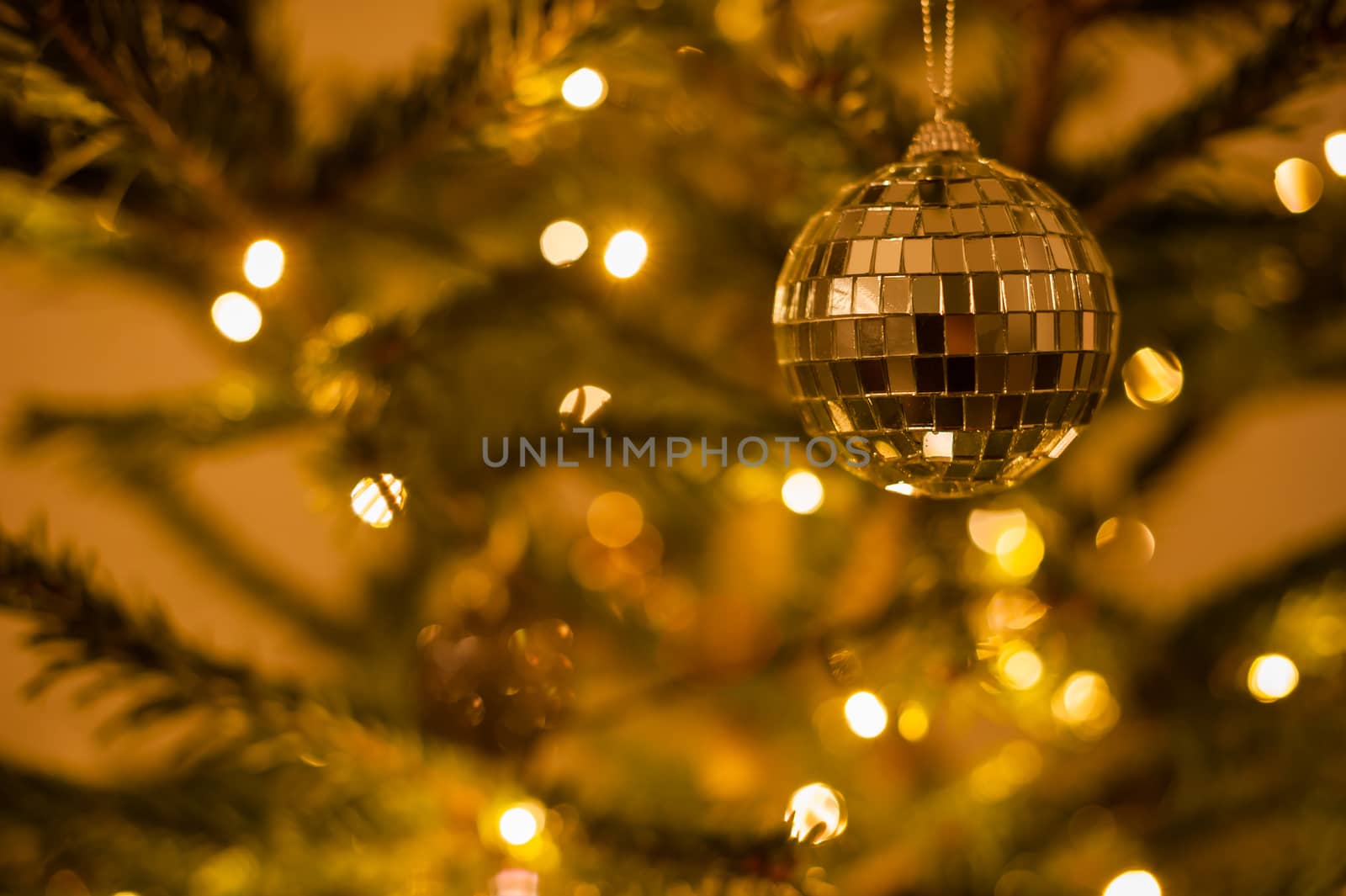Christmas illuminations and ball decorations on a pine tree