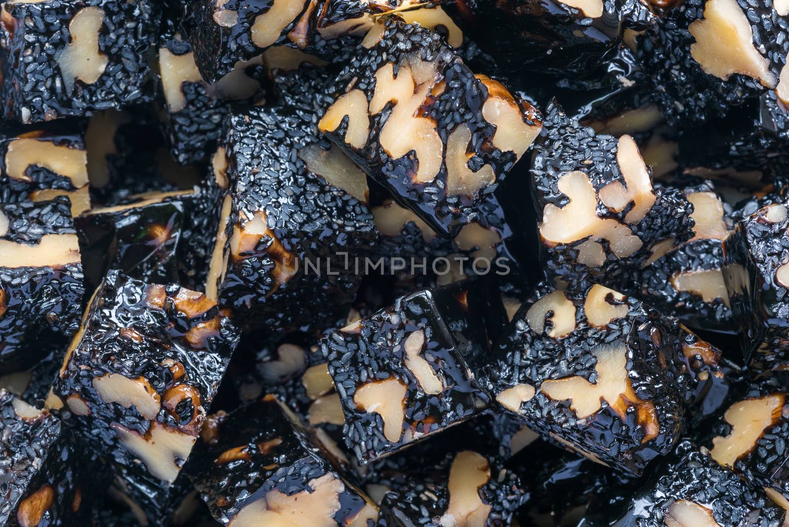 Ejiao Gao walnut and sesame donkey hide gelatin cubes close-up for use in chinese traditional medicine