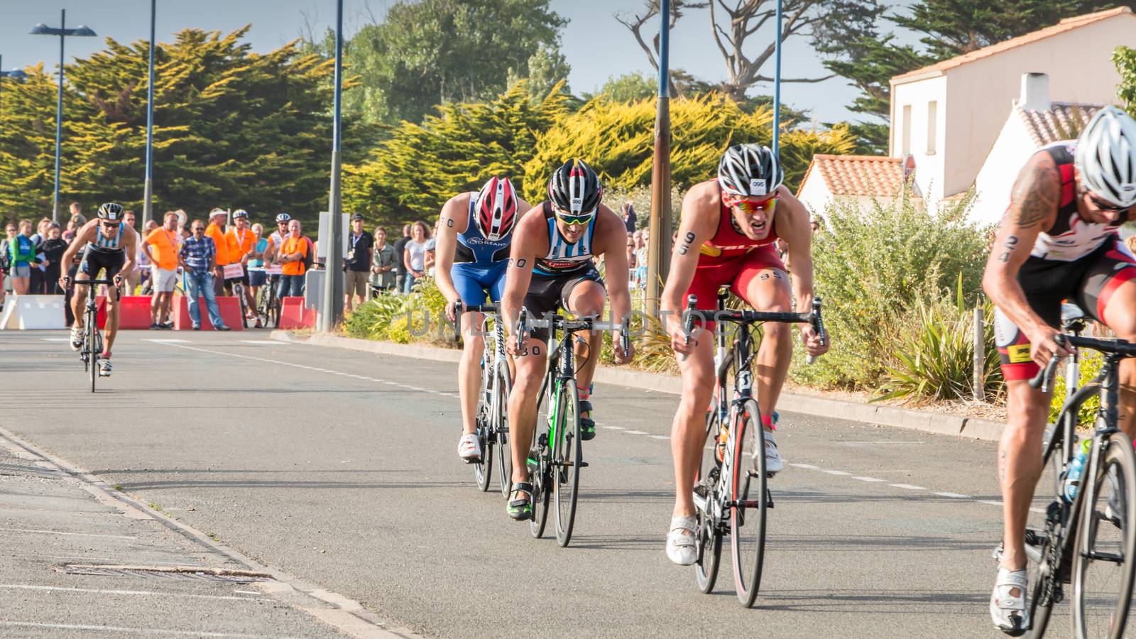 Saint Gilles Croix de Vie, France - September 10, 2016 : Final triathlon championship of France in the category D3 - cyclists straight for a road bike race