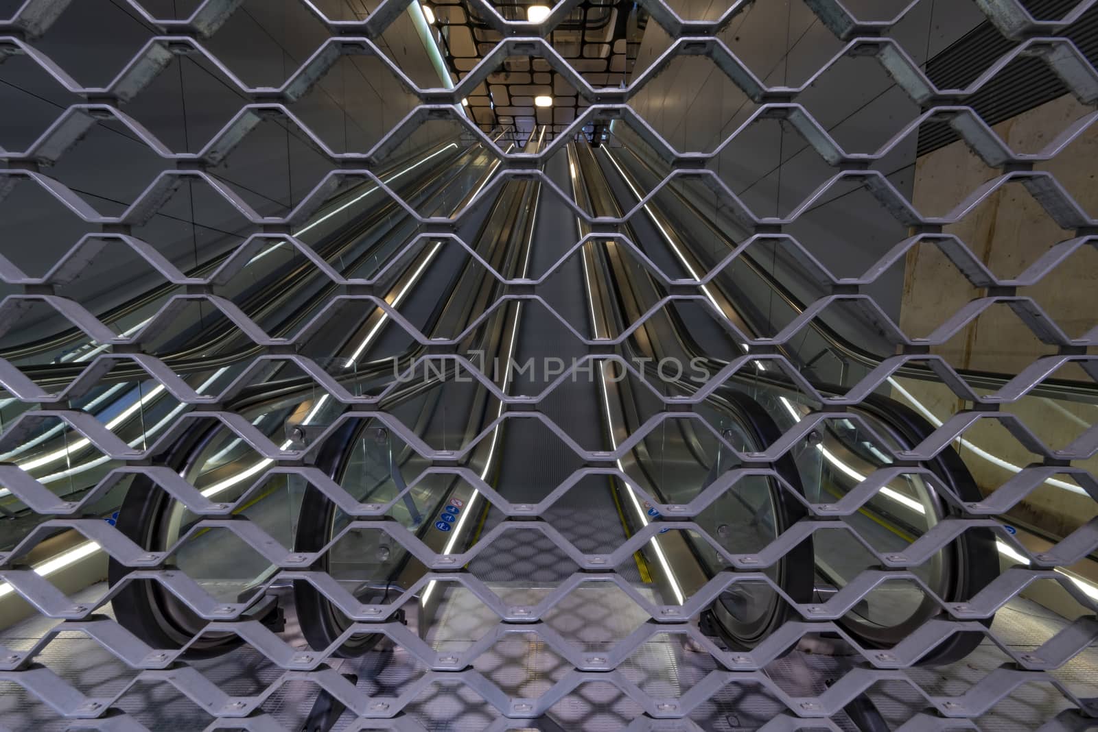 Closed entrance fence of the Paris underground during a strike preventing people to get in. by ankorlight