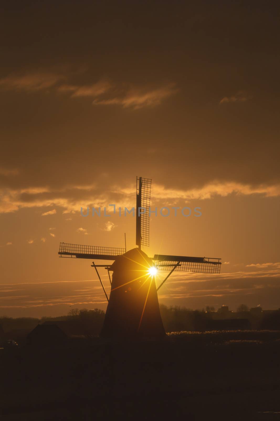 Warm and vibrant sunrise over the Unesco world heritage windmill in Leidschendam, Kinderdijk, Netherlands  by ankorlight