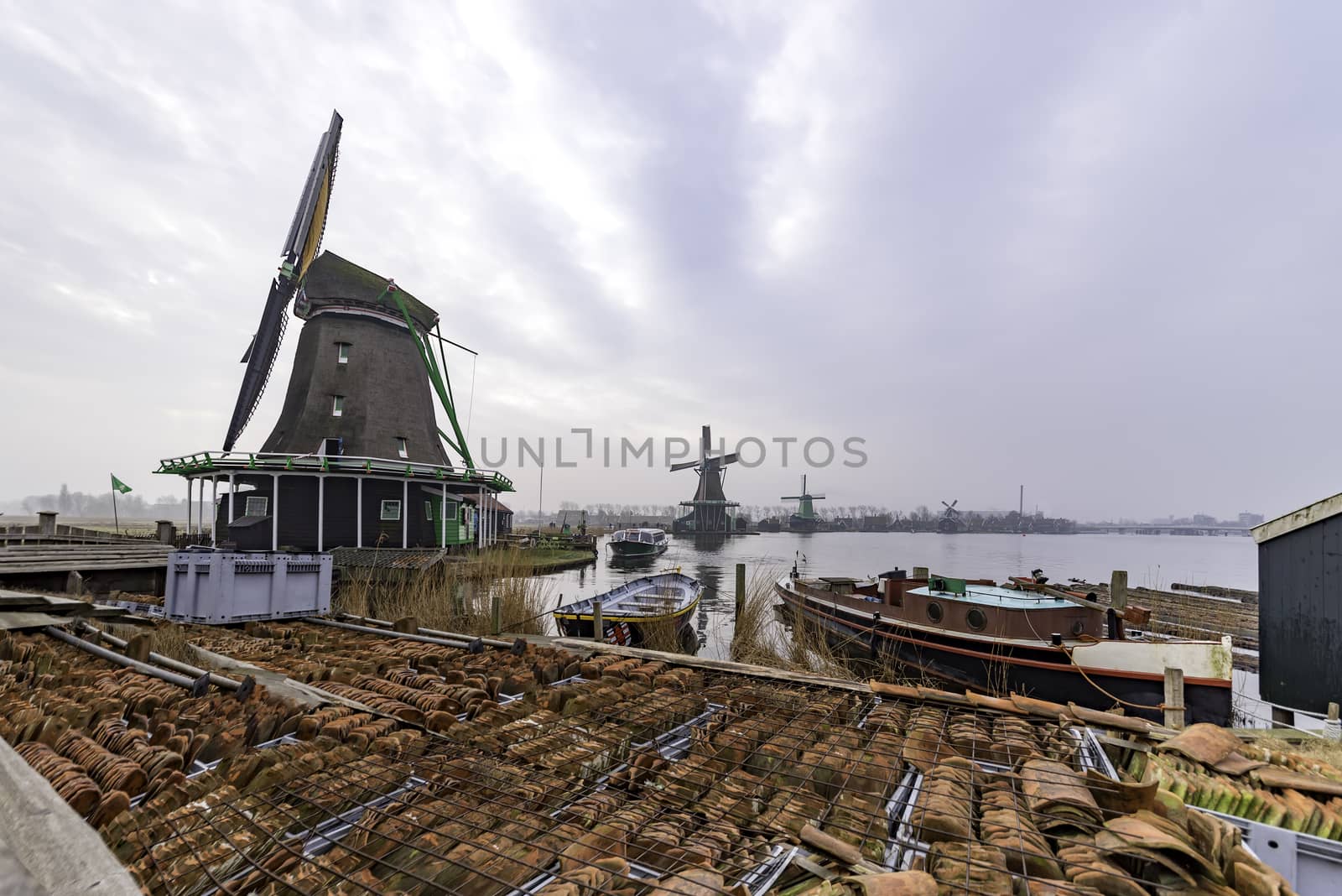 Tiles warehouse or storage at the river side nested to the green sawmills at Zaanse Schans city in Netherlands