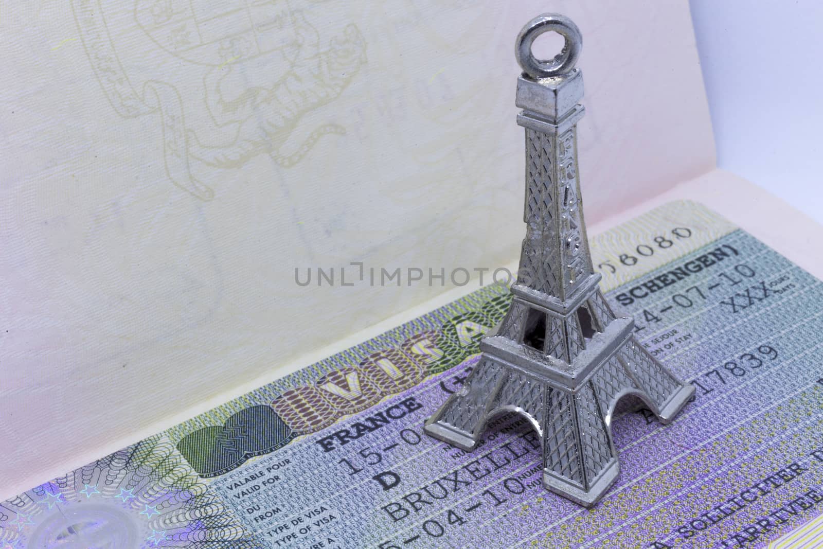 Close up of the Eiffel tower keychain on the Schengen visa allowing the passport holder to travel inside the Schengen treaty territory