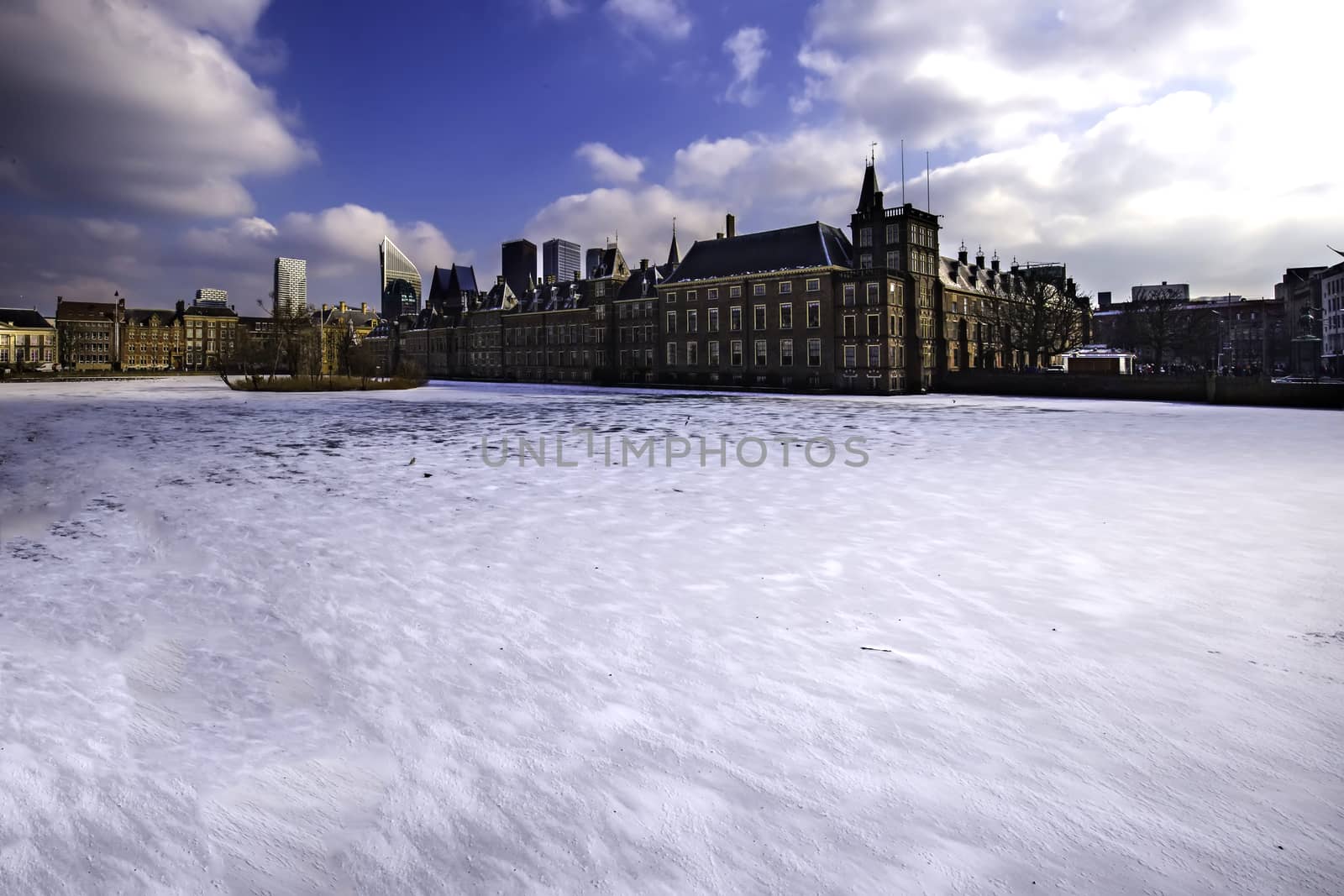 Panoramic view of the Dutch parliament building and its frozen pond water with place for messages or texts by ankorlight