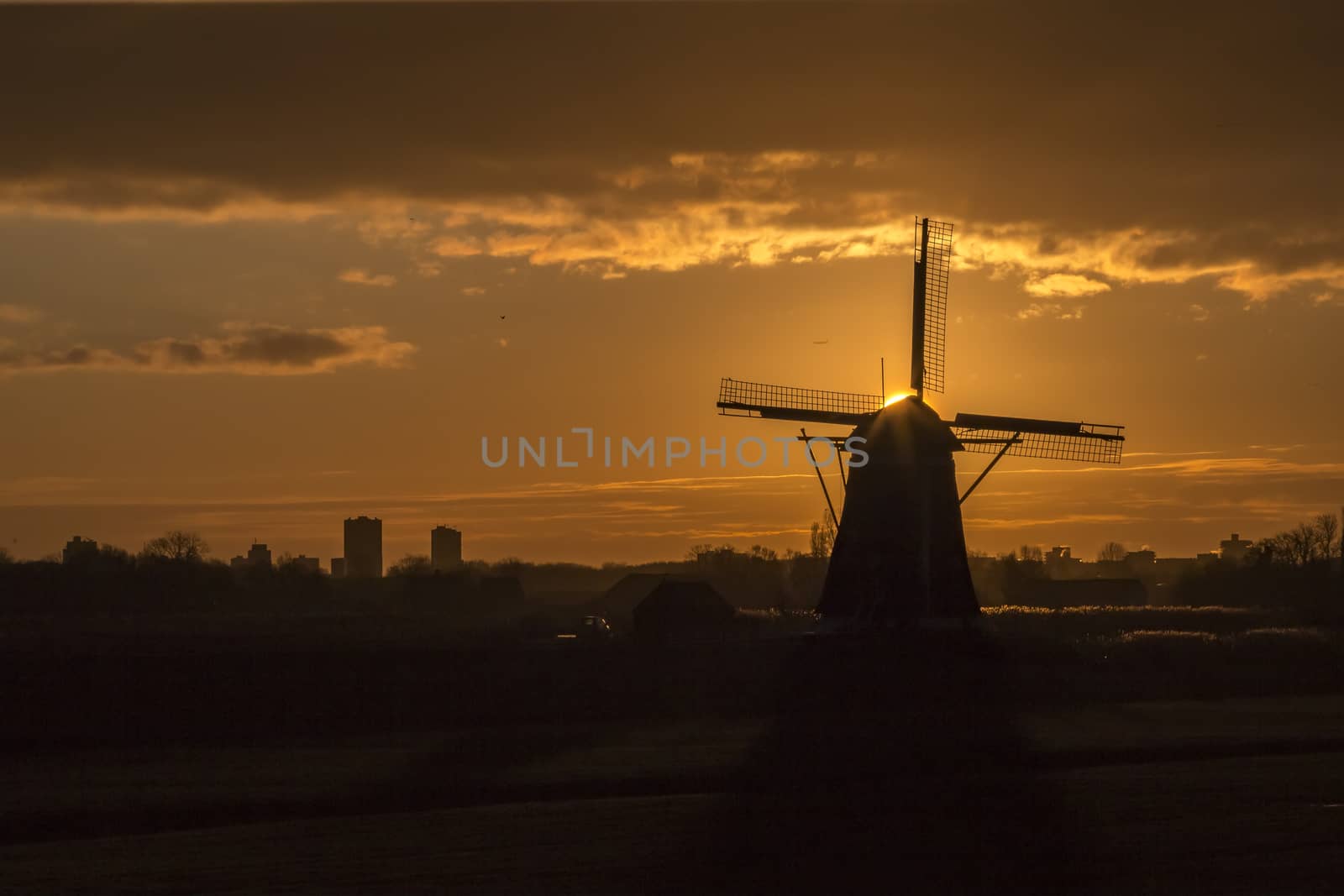 Warm and vibrant sunrise over the Unesco world heritage windmill in Leidschendam, Kinderdijk, Netherlands  by ankorlight