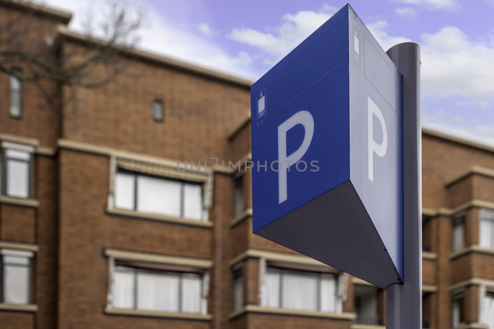 Parking panel and sign in a resident area under a bleu ski by ankorlight