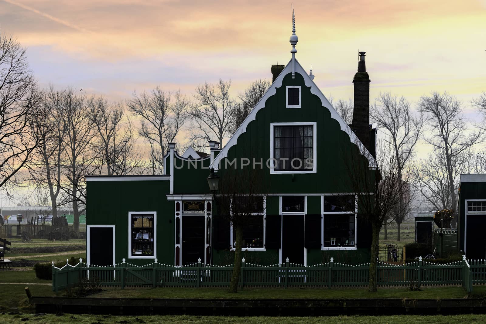 Beaucoutif typical Dutch wooden houses architecture along the calm canal of Zaanse Schans located at the North of Amsterdam, Netherlands by ankorlight