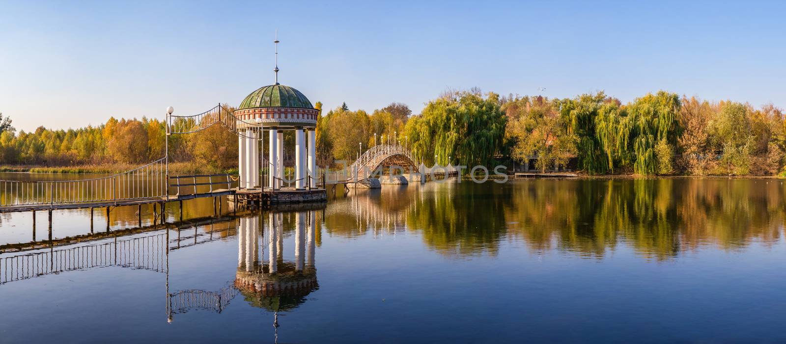 Gazebo in the middle of the lake at fall by Multipedia