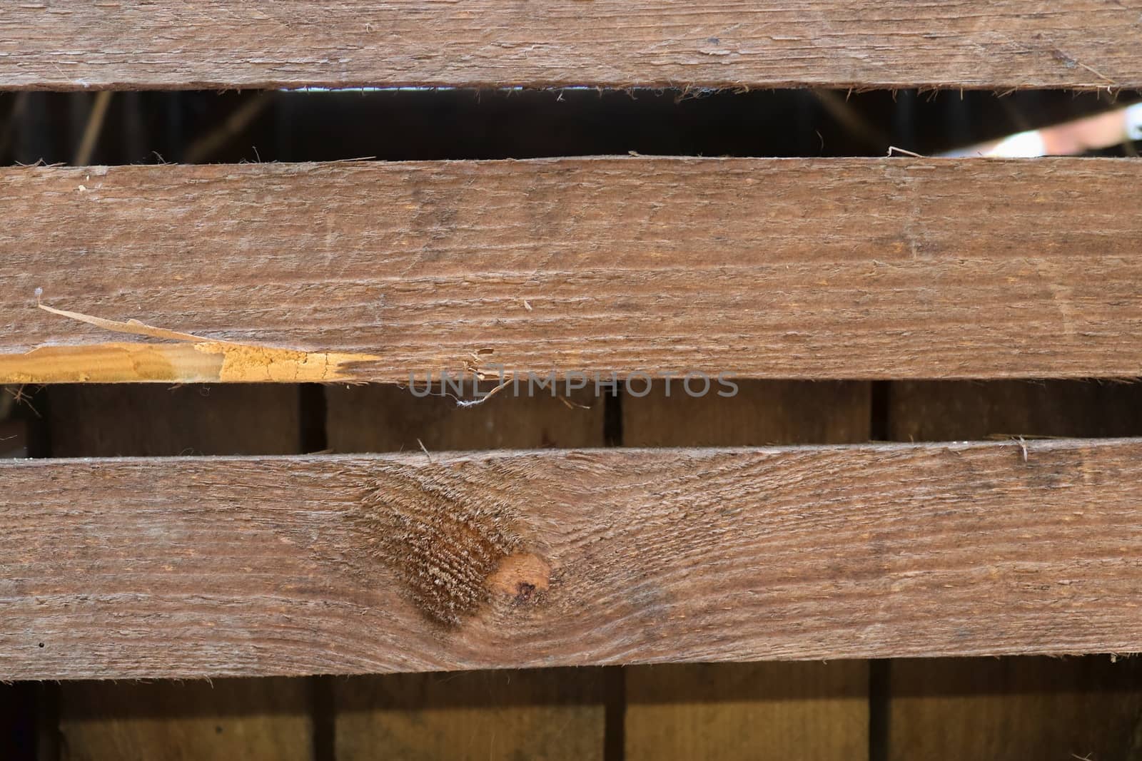 Very old wooden crates with some cracks in a close view