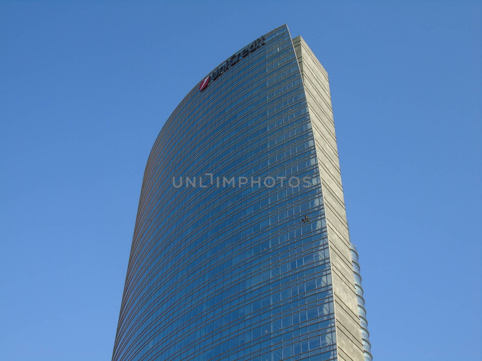 Milano, Italy - 02/14/2020: Amazing photography to the Skyscrapers of Milano in winter days with some people, a great blue sky and some details of the exterior part of the structure