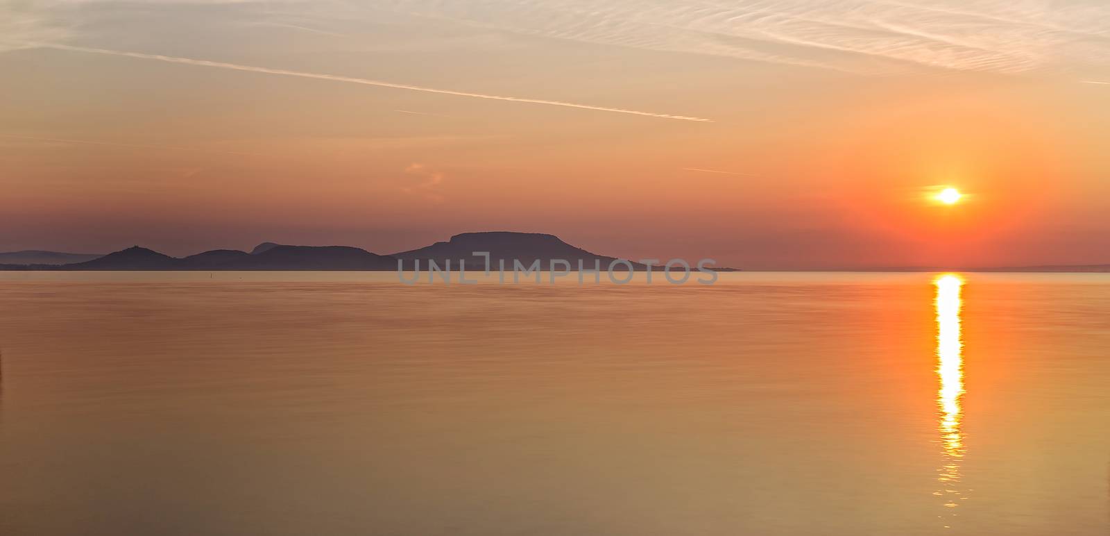 Sunrise over the lake Balaton of Hungary by Digoarpi