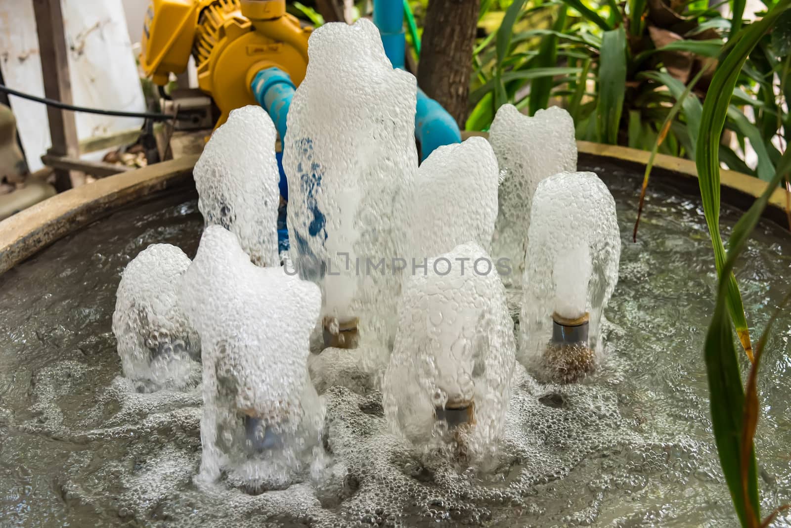 Small fountain at garden, Blue water flowing by Bubbers
