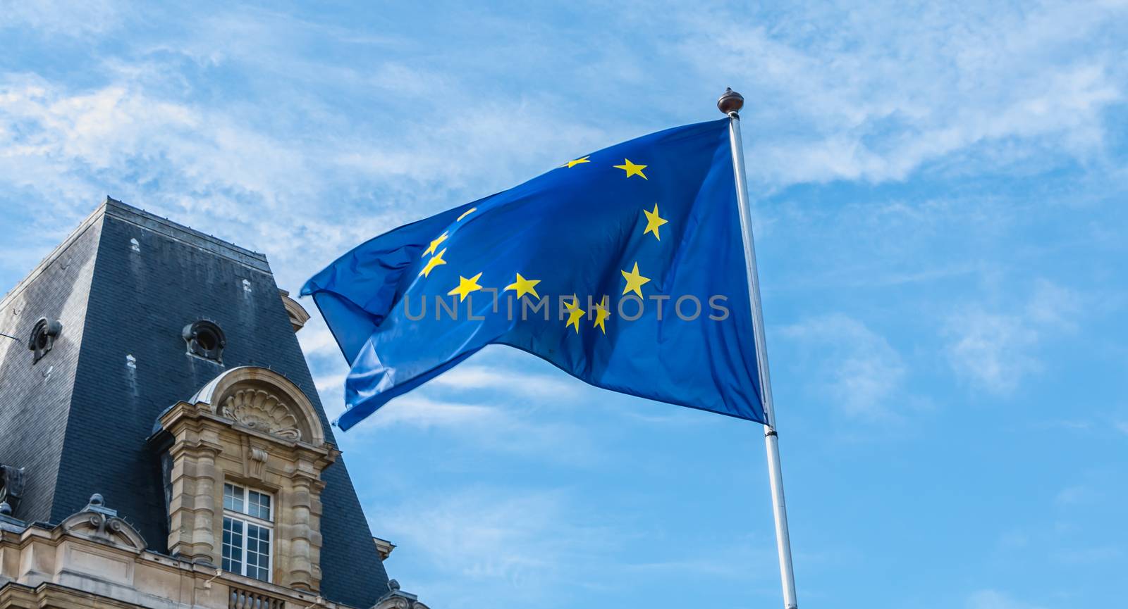 european flags flying in front of a town hall by AtlanticEUROSTOXX