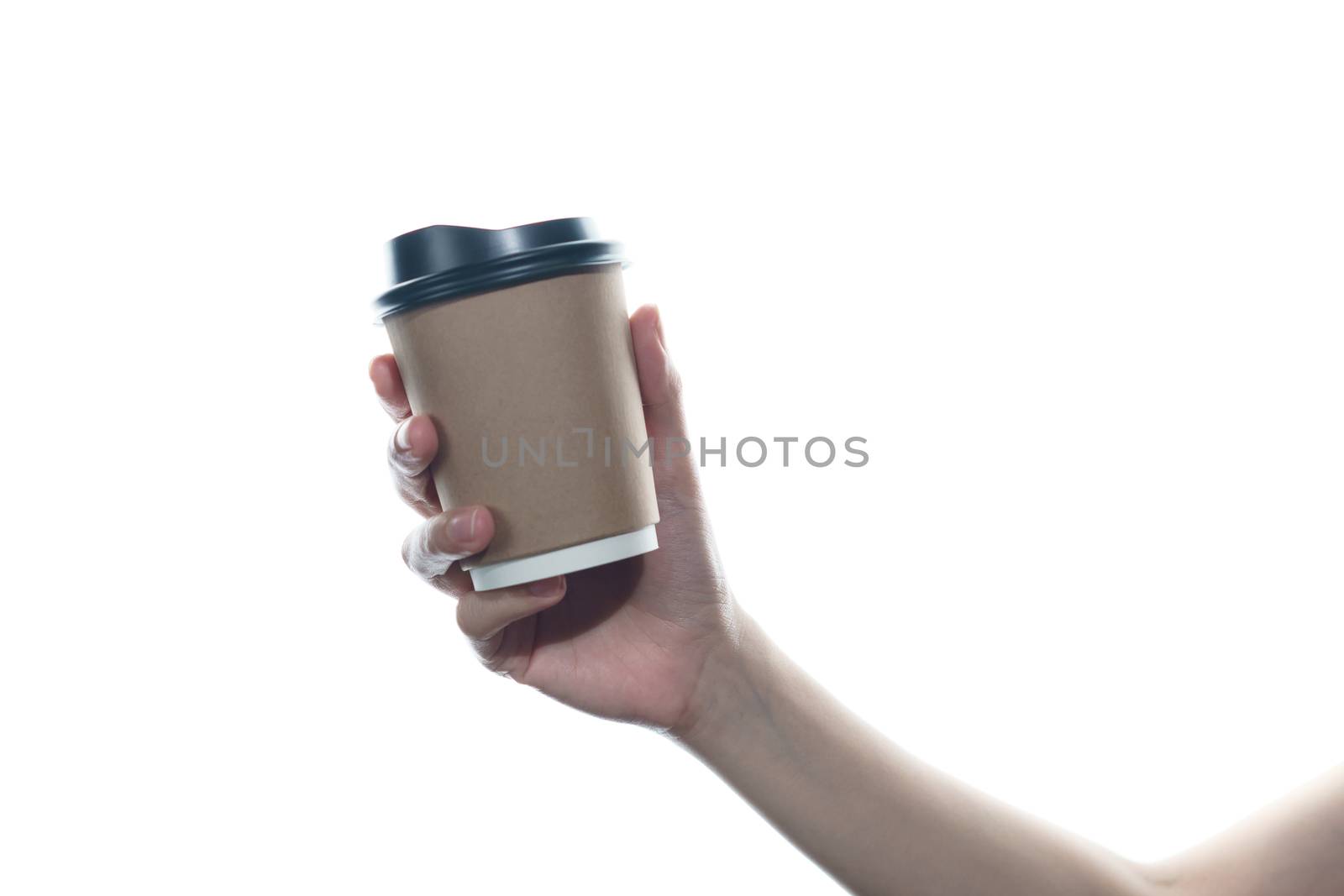 Woman hand holding a brown coffee paper cup isolated on white background.