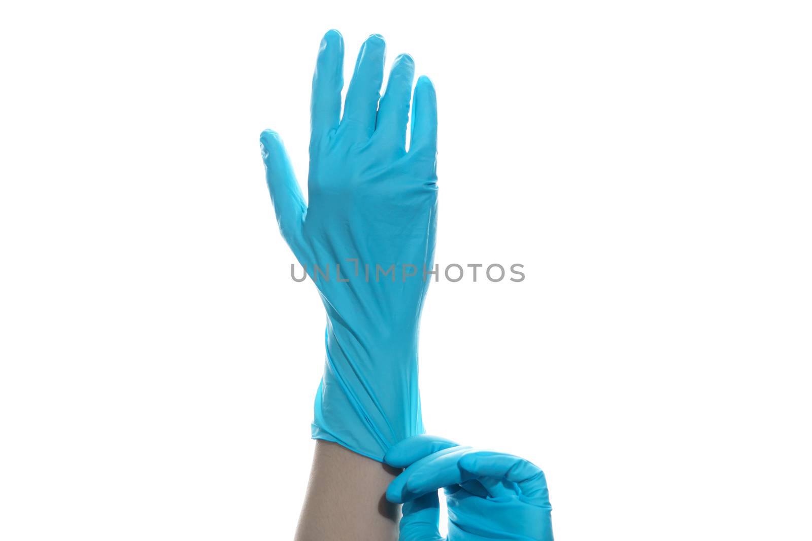 Woman hand wearing a blue rubber medical glove on white isolated background.