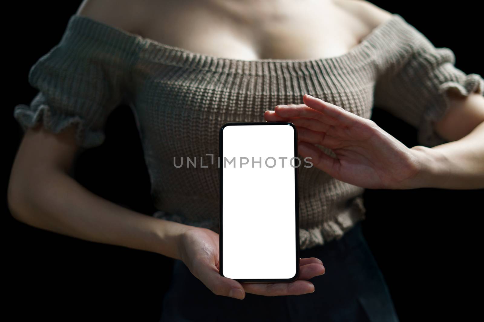 Sexy woman showing white blank display of her mobile phone.