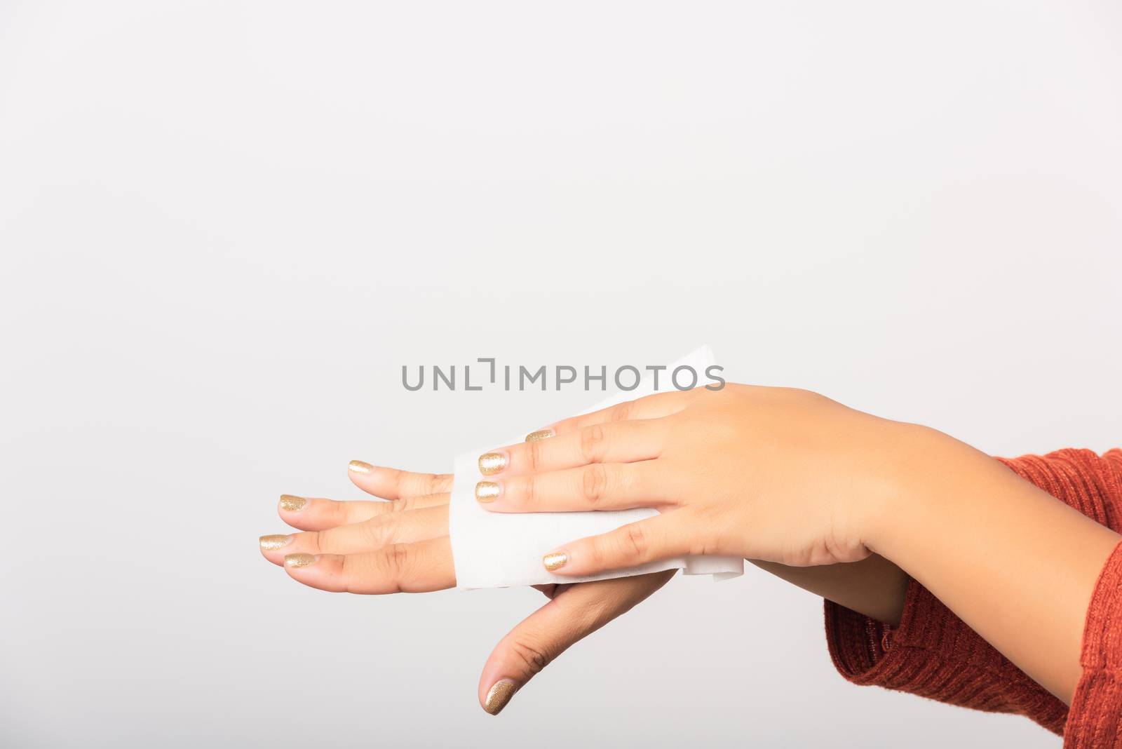 Close up hand of Asian woman she using wet tissue paper wipe cleaning her hands, studio shot isolated on white background, Healthcare medicine body care concept
