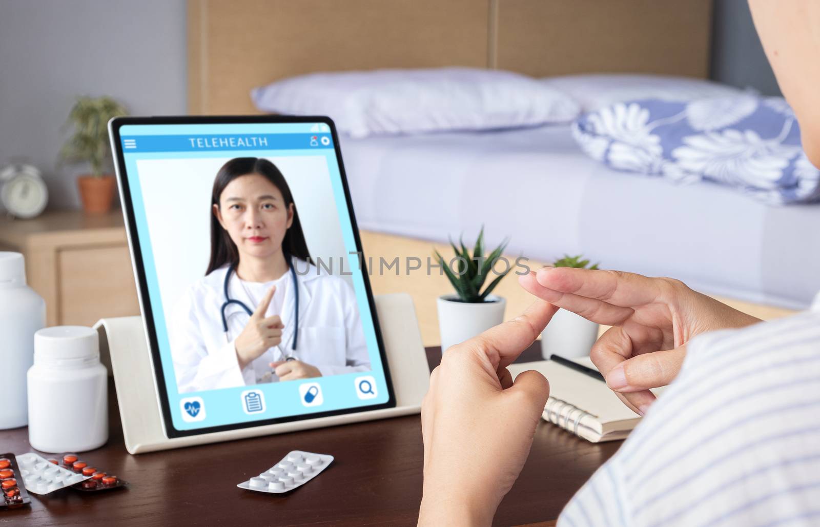 deaf mute patient use video conference, make online consultation by sign language with doctor on tablet application about illness, medicine via vdo call. Telehealth, Telemedicine, online hospital by asiandelight