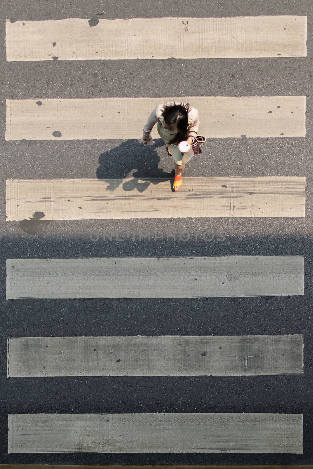 Bangkok, Thailand - March 31, 2016 : Crosswalk or Zebra crossing in Bangkok city. Bangkok is the capital and the most populous city of Thailand.