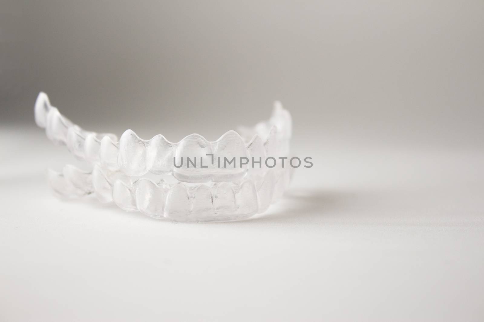 Postural plastic denture teeth correction.