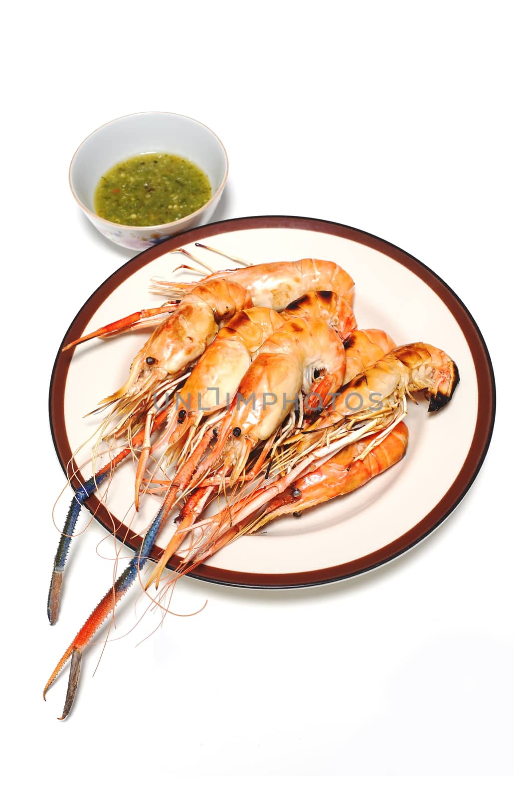 Grilled Shrimps on plate with Thai Seafoods Dipping Sauce. on white background.