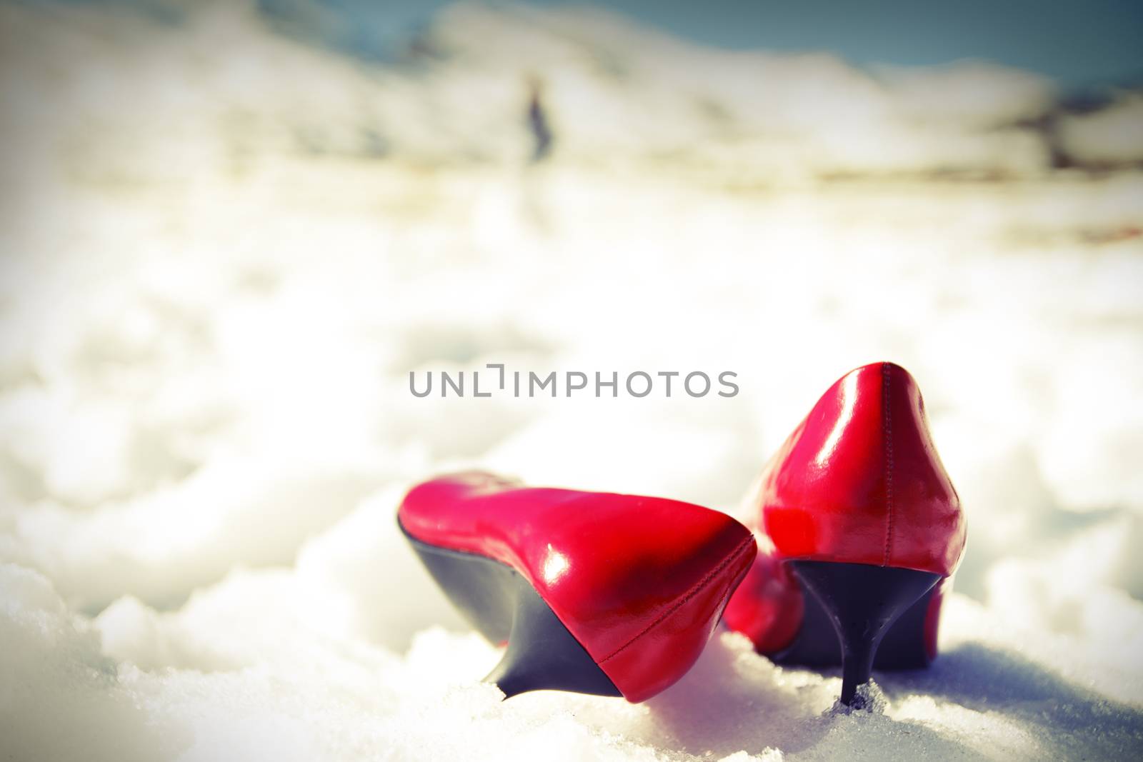 Red shoes in the snow. Cross processing filter added.