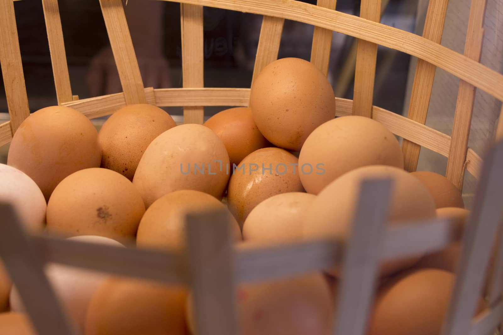 Basket full of white and brown eggs 