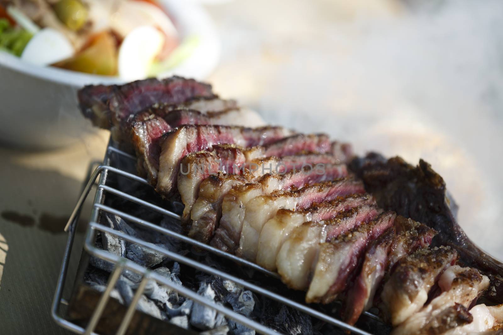 Steak with salad and fries.