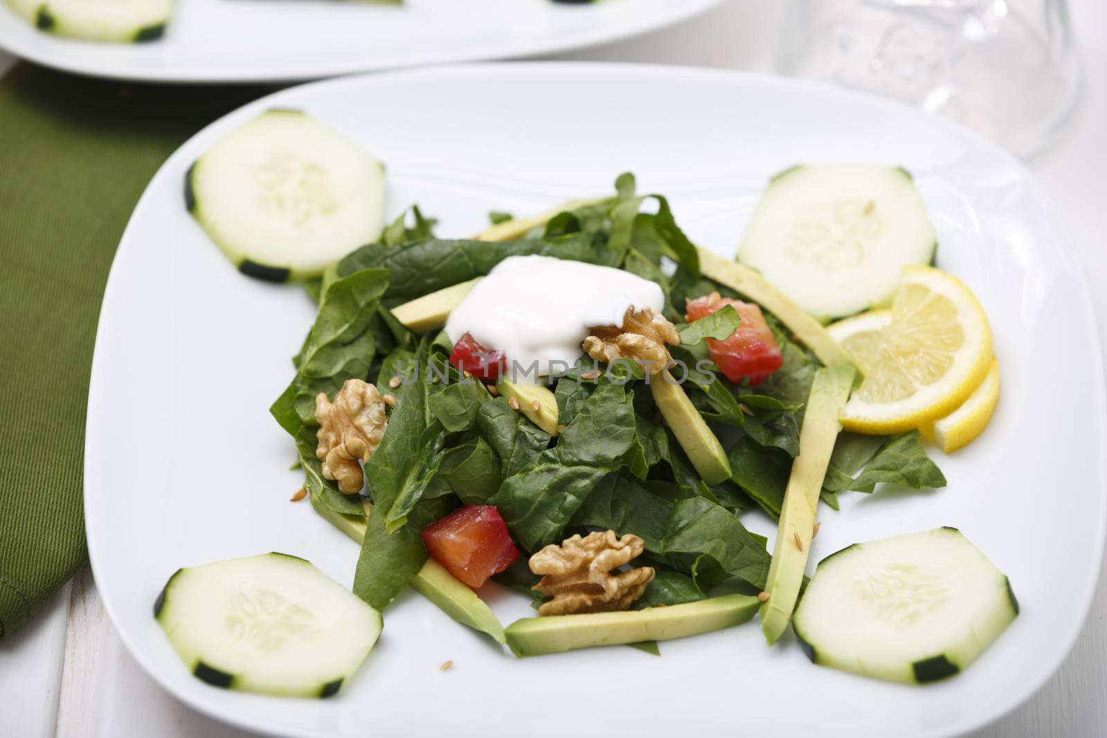 Spinach salad with lox and avocado.