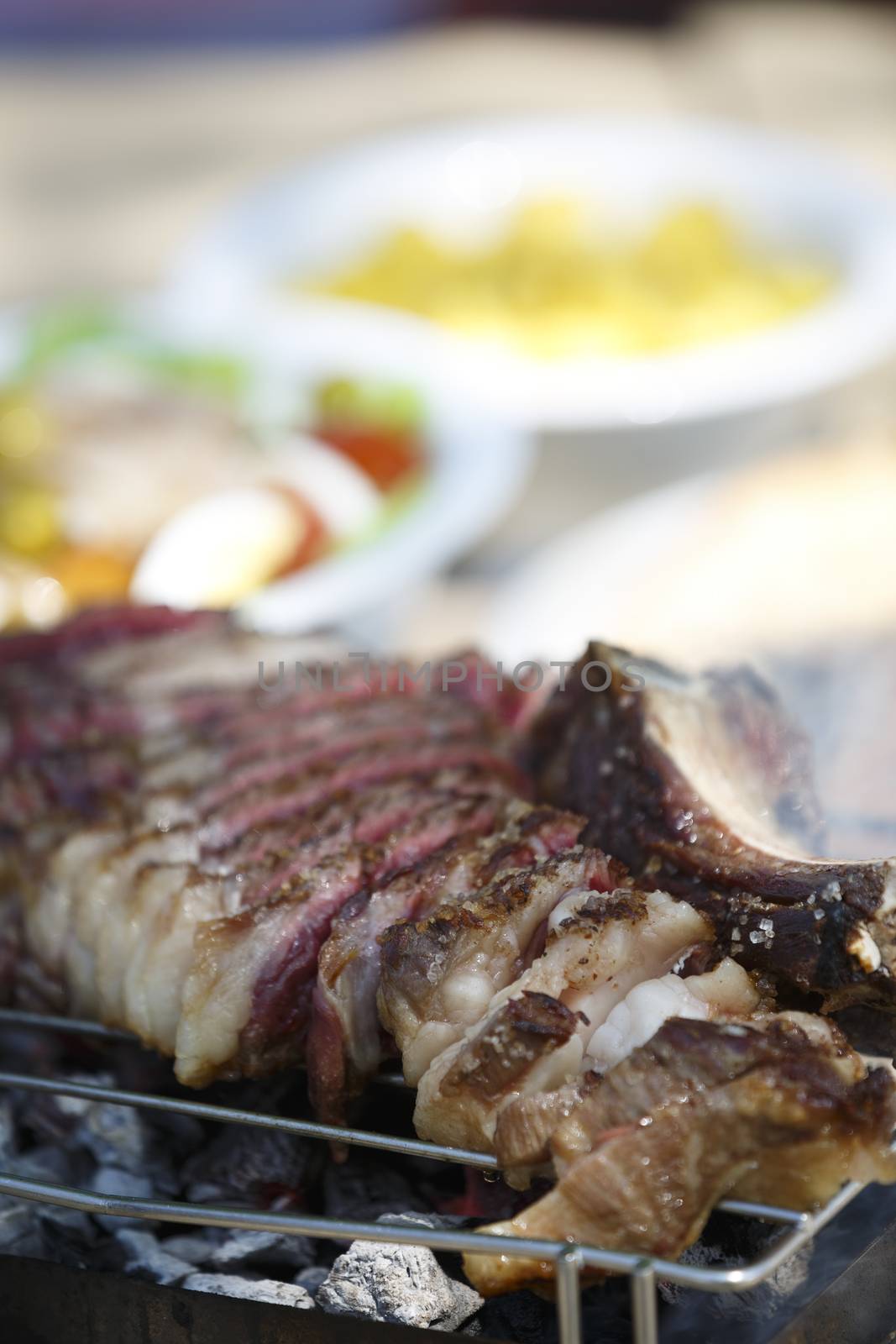 Steak with salad and fries.