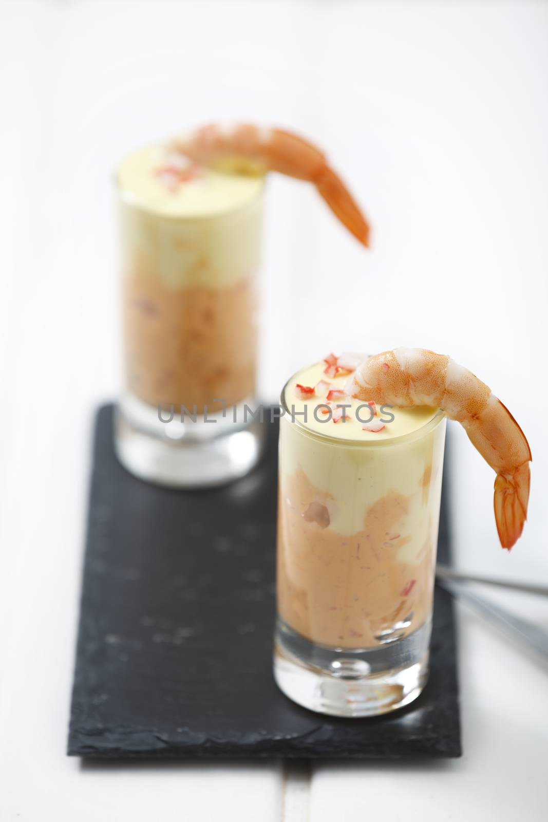 Delicious appetizer of prawn and crab with thousand island dressing sauce at bottom and mayoinnaise on top.	