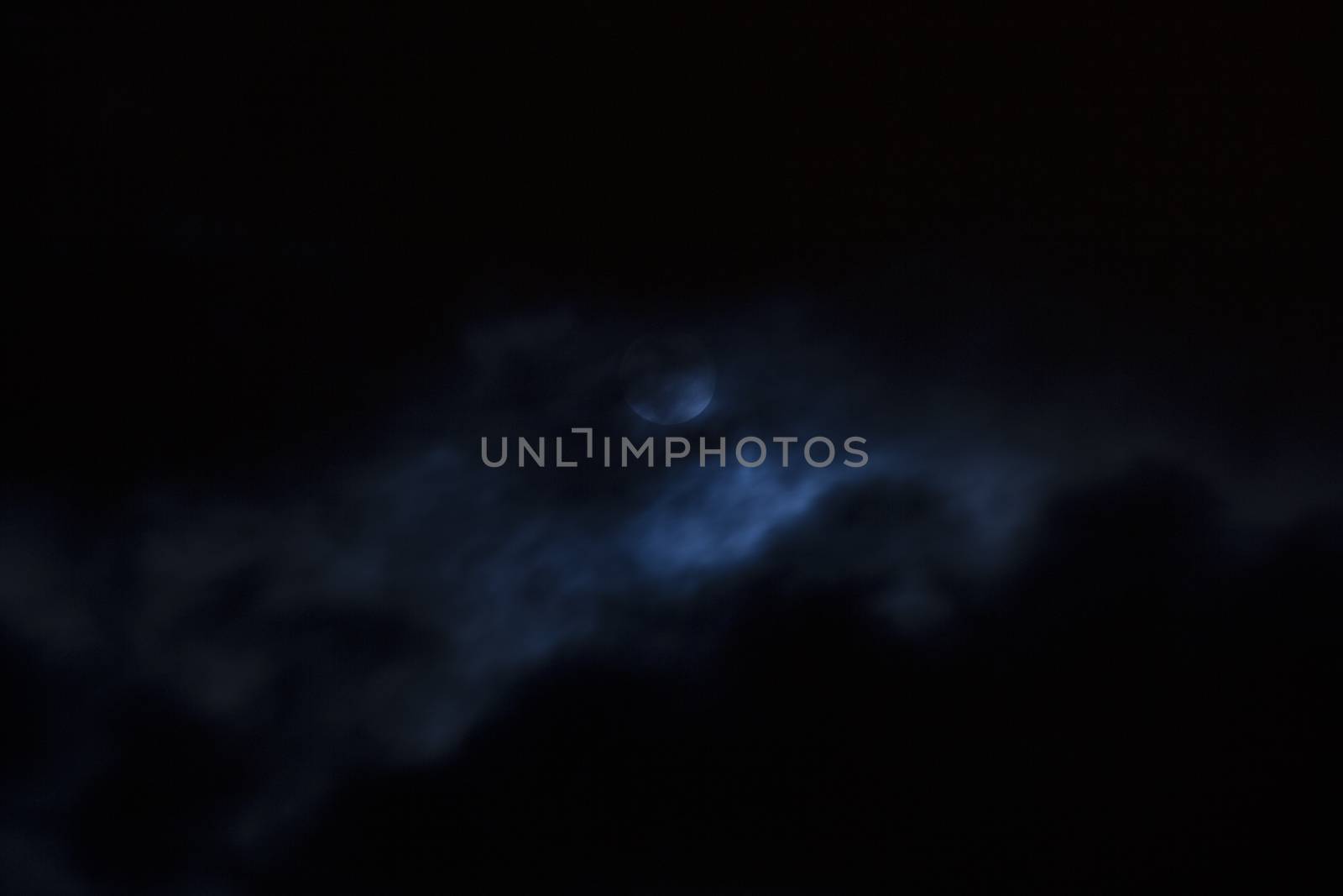 Full moon covered with clouds.