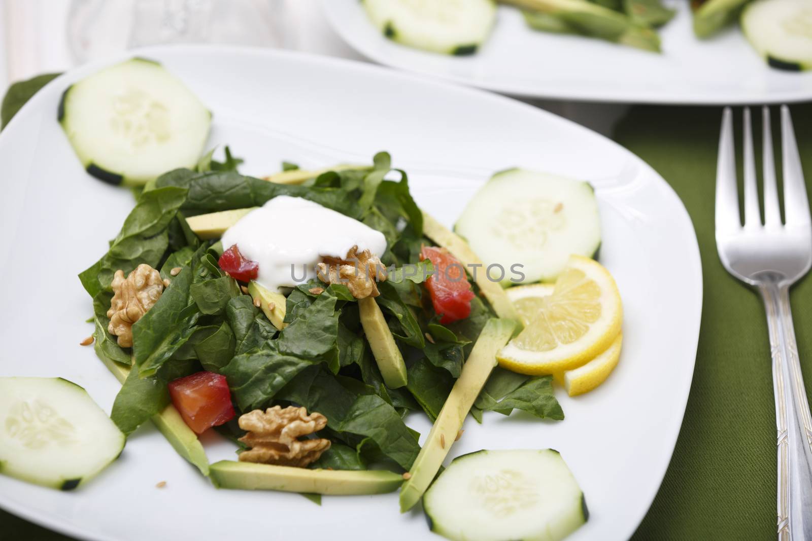 Spinach salad with lox and avocado.