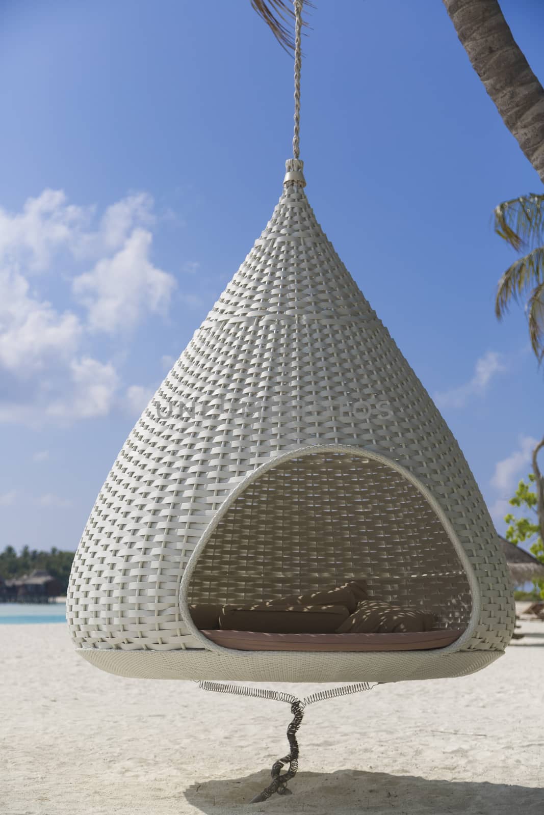 Detail of the inside of a Cocoon hammock in the beach.