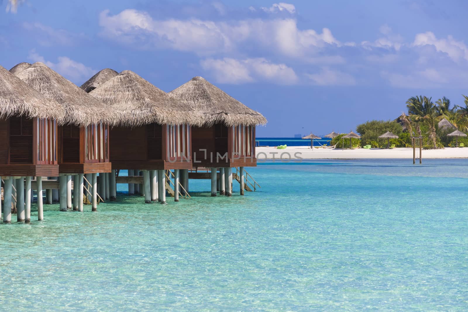 View of Over Water Bungalow in The Maldives. There is an Island  by Nemida