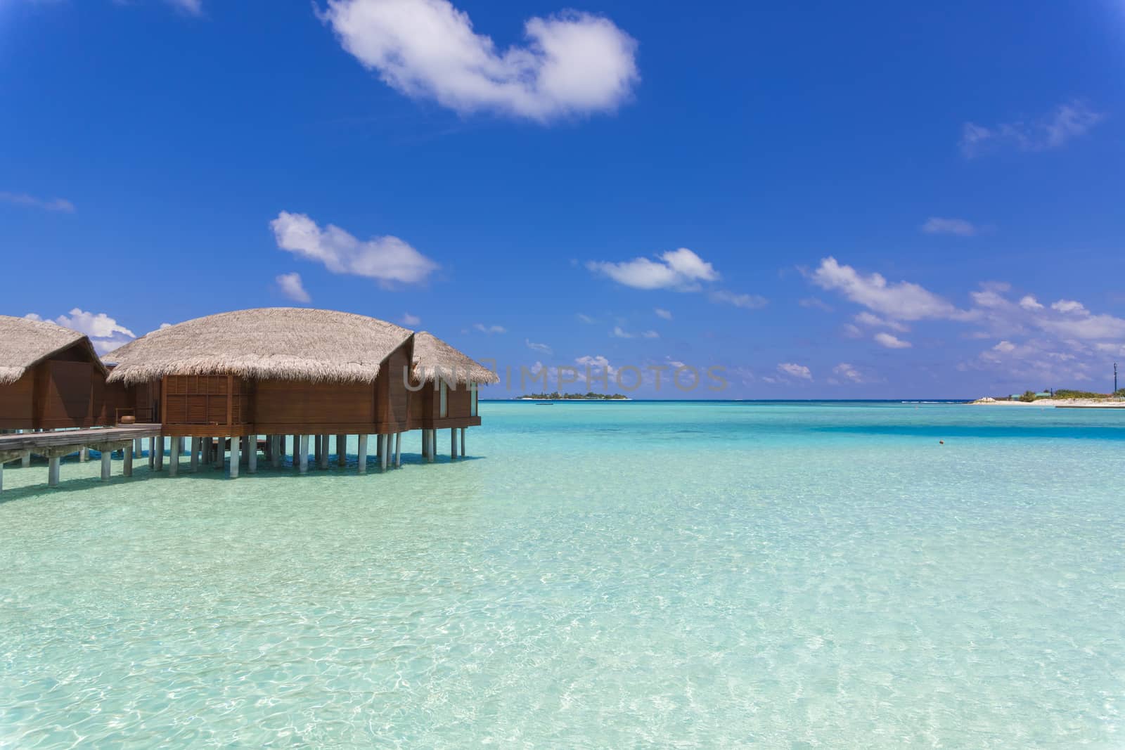 Over Water Bungalow in Maldives in a Sunny Day by Nemida