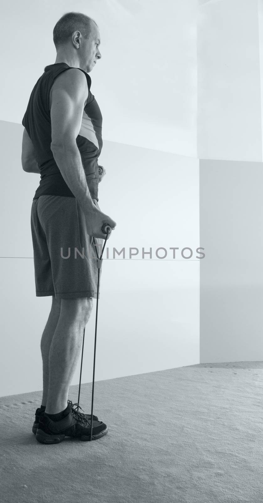 Man with resistance rope fitness by GemaIbarra